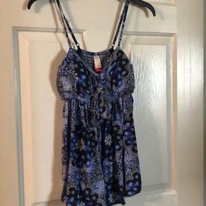 Super cute spaghetti strapped shirt. Has pads and cut out sides. Brand new!